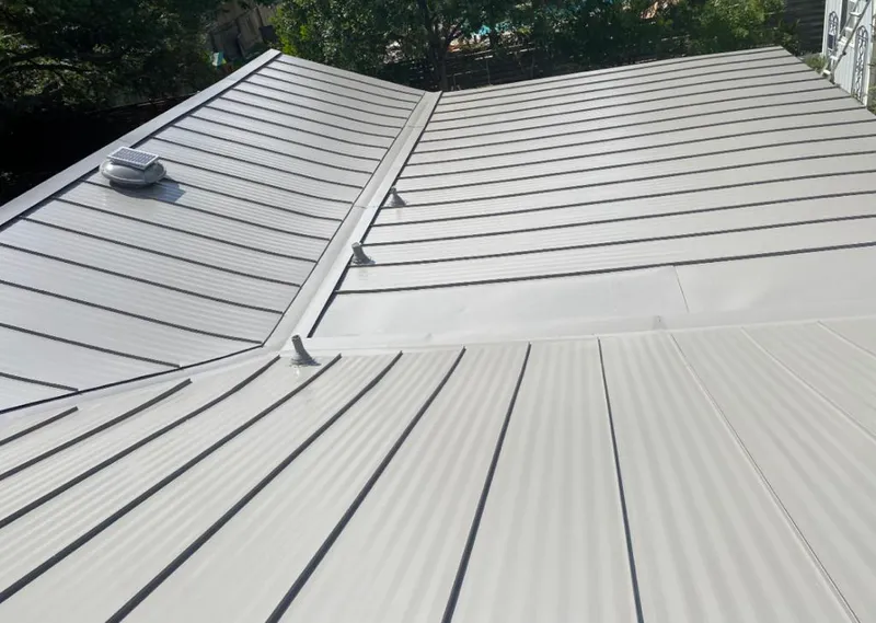 Solar attic fan installed on a metal roof for Roof Ventilation in Rifle